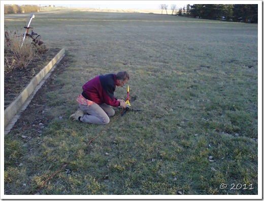 Man lines up and configures model rocket to fire